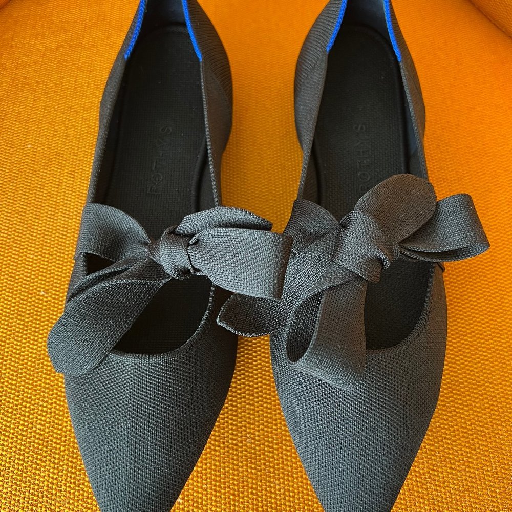Rothy's Black pointed flat with bow